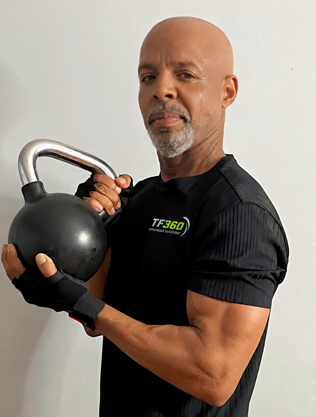 Ellis Levember, TF360 coach, holding a kettlebell